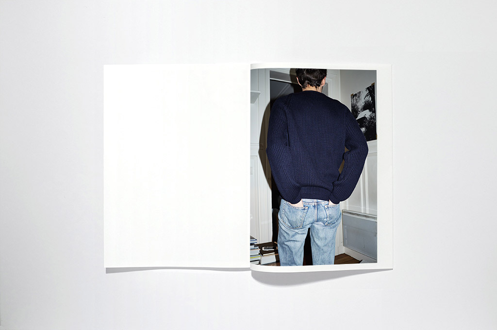 Cristaseya, Homme Catalogue, double spread with a model, view from the back, with his hands in the pockets. Photo by Andrea Spotorno.