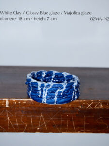 Catalogue design for Cristaseya ceramics collection edition 8, internal spread with a blue vase. Photo by Andrea Spotorno.