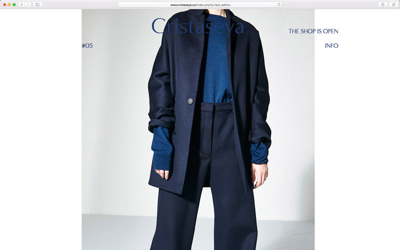 Cristaseya, website design, screen from edition 5 with a model wearing a blue wool jacket and pants, photo by Andrea Spotorno