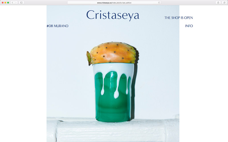 Cristaseya, website design, screen from edition 8 Murano with a green and white decorated glass and a fruit, photo by Andrea Spotorno